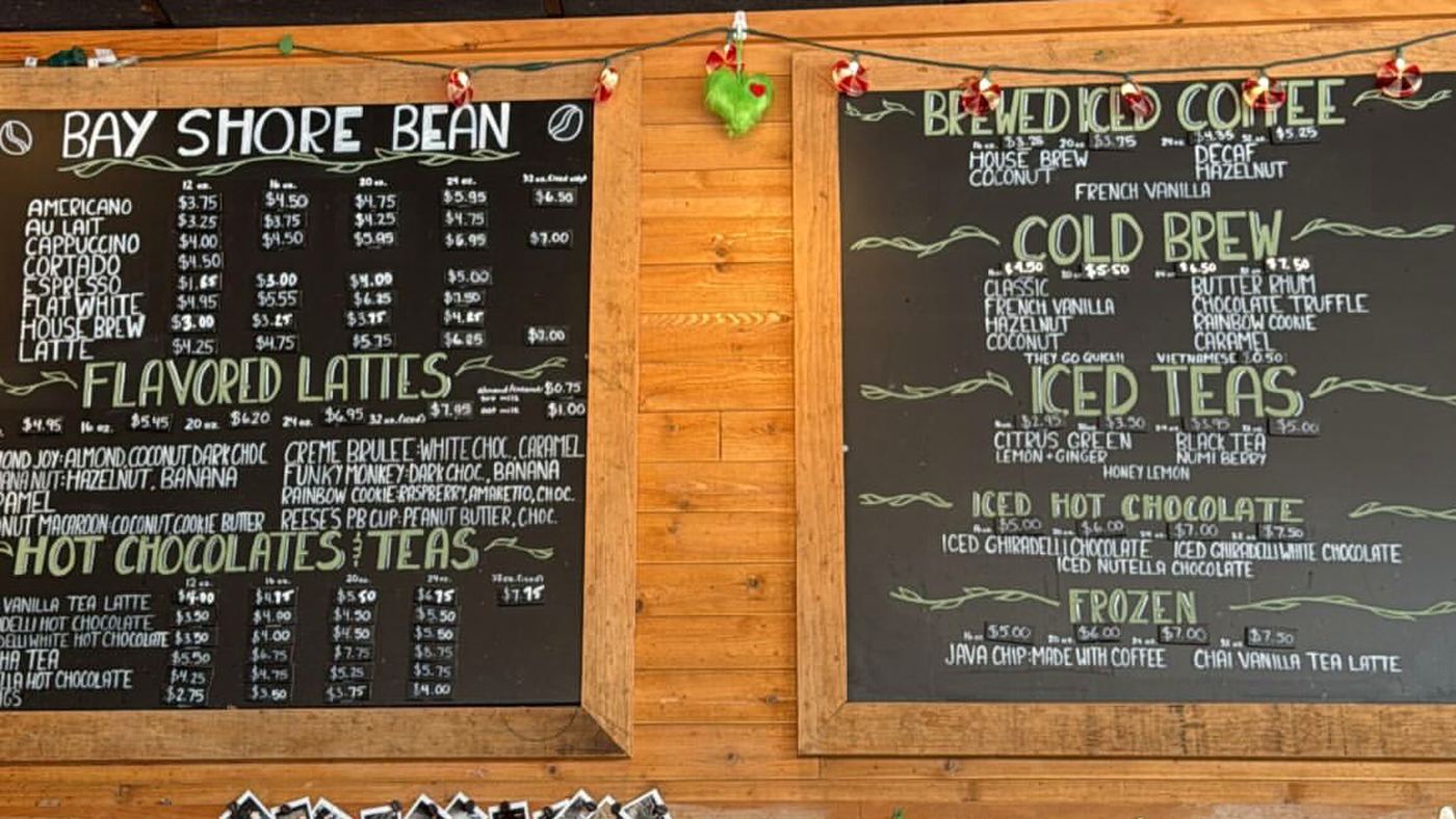The two chalkboard menus above the counter